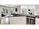 Bright kitchen with a sliding door to the deck, stainless steel appliances, and doorway to the dining room at 826 N Lanyard Dr, Cicero, IN 46034