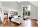 Open concept living area with high ceilings and hardwood floors, overlooking the backyard and patio at 826 N Lanyard Dr, Cicero, IN 46034
