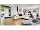 Open concept living area with hardwood floors and modern décor flows into dining and kitchen area at 826 N Lanyard Dr, Cicero, IN 46034