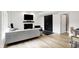 Cozy living room with a fireplace, TV, barn door, and a modern sofa at 826 N Lanyard Dr, Cicero, IN 46034