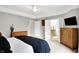 Bright main bedroom features neutral walls, carpet, and a view into the ensuite bathroom at 826 N Lanyard Dr, Cicero, IN 46034