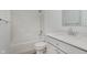 Bright bathroom with white vanity, sink, and a shower-tub combination at 848 Holmdale Dr, Indianapolis, IN 46239