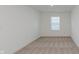 Neutral bedroom featuring plush carpeting, a window, and a crisp, neutral paint at 848 Holmdale Dr, Indianapolis, IN 46239
