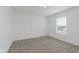 Bright bedroom features carpeted floors, a window, and neutral paint at 848 Holmdale Dr, Indianapolis, IN 46239