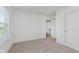 A bright bedroom with light-colored carpet and access to an additional room at 848 Holmdale Dr, Indianapolis, IN 46239