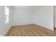 Neutral bedroom featuring vinyl plank flooring and a large window with blinds at 848 Holmdale Dr, Indianapolis, IN 46239
