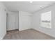 Bedroom featuring carpeted floors, a closet with sliding doors, and a window view at 848 Holmdale Dr, Indianapolis, IN 46239