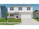 Two-story home with white and gray siding, black shutters, manicured lawn, and two car garage at 848 Holmdale Dr, Indianapolis, IN 46239