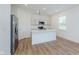 Bright kitchen with stainless steel appliances, quartz countertops, and center island with sink at 848 Holmdale Dr, Indianapolis, IN 46239