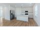 Bright open kitchen with stainless steel appliances, quartz countertops, and center island at 848 Holmdale Dr, Indianapolis, IN 46239