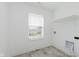 The laundry room with tile flooring and a storage shelf at 848 Holmdale Dr, Indianapolis, IN 46239