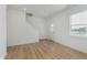 Bright open living room with luxury vinyl plank flooring, natural light, and staircase at 848 Holmdale Dr, Indianapolis, IN 46239