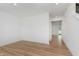 Bright and open living room with modern recessed lighting and wood look floors at 848 Holmdale Dr, Indianapolis, IN 46239