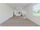 Open floor plan showcasing a living room, kitchen with island, and sliding glass doors at 848 Holmdale Dr, Indianapolis, IN 46239