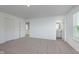Spacious main bedroom with ensuite bathroom access, large closets, and neutral carpet at 848 Holmdale Dr, Indianapolis, IN 46239