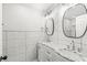 Bathroom featuring double vanity with marble countertop and modern fixtures at 911 Eastern Ave, Indianapolis, IN 46201