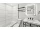 This bathroom has a black faucet, a lighted mirror, and tile at 911 Eastern Ave, Indianapolis, IN 46201