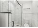 Modern bathroom featuring a glass shower with stylish black hardware and white tiled walls at 911 Eastern Ave, Indianapolis, IN 46201