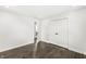 This bedroom features dark hardwood floors and a closet with bi-fold doors at 911 Eastern Ave, Indianapolis, IN 46201