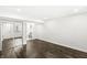 This bedroom features dark hardwood floors and an open bathroom concept at 911 Eastern Ave, Indianapolis, IN 46201