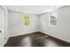 Bedroom featuring hardwood floors and natural light at 911 Eastern Ave, Indianapolis, IN 46201