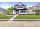 Beautiful two-story home with manicured lawn and inviting walkway, perfect for families and entertaining at 911 Eastern Ave, Indianapolis, IN 46201