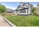 Well-maintained front yard and charming two-story home in a desirable neighborhood, close to amenities at 911 Eastern Ave, Indianapolis, IN 46201
