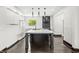 Modern kitchen island with quartz countertops and stainless steel appliances at 911 Eastern Ave, Indianapolis, IN 46201