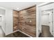 Room featuring wood paneling, dark hardwood floors, and white trim at 911 Eastern Ave, Indianapolis, IN 46201