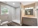 Updated bathroom featuring a marble shower, modern fixtures, and stylish vanity at 9378 N County Road 75 W, Lizton, IN 46149
