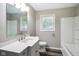 Bright bathroom showcasing a modern vanity, fresh white cabinets, and tub shower at 9378 N County Road 75 W, Lizton, IN 46149