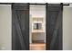 Bathroom with a dark wood sliding door and a vanity with drawers and cabinets at 9378 N County Road 75 W, Lizton, IN 46149