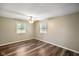 Cozy bedroom with wood-look floors, neutral walls, and bright, natural light at 9378 N County Road 75 W, Lizton, IN 46149