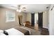 Bedroom with sliding barn door access to bathroom and ample natural light at 9378 N County Road 75 W, Lizton, IN 46149