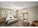 Cozy bedroom with a ceiling fan, wood floor and natural light at 9378 N County Road 75 W, Lizton, IN 46149