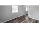 Bedroom featuring modern plank flooring, neutral paint and a mirrored closet door at 9378 N County Road 75 W, Lizton, IN 46149