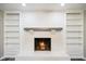 Close up of brick fireplace featuring built-in bookshelves on either side at 9378 N County Road 75 W, Lizton, IN 46149