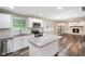 Bright kitchen boasts granite countertops, stainless steel appliances, and a functional island at 9378 N County Road 75 W, Lizton, IN 46149