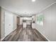 Open-concept kitchen with stainless appliances, granite countertops, and kitchen island with seating at 9378 N County Road 75 W, Lizton, IN 46149