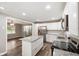 Bright kitchen featuring granite counters, white cabinets, and stainless appliances at 9378 N County Road 75 W, Lizton, IN 46149
