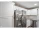 Corner kitchen featuring a stainless steel refrigerator, granite countertops and modern cabinetry at 9378 N County Road 75 W, Lizton, IN 46149