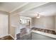 Open-concept living area flowing into a kitchen with granite countertops at 9378 N County Road 75 W, Lizton, IN 46149