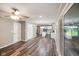 View from the living room to the kitchen with stainless appliances, granite countertops, and kitchen island at 9378 N County Road 75 W, Lizton, IN 46149