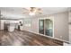 Open floor plan with a view from the living room to the kitchen and sliding glass door to backyard at 9378 N County Road 75 W, Lizton, IN 46149