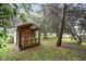 A whimsical backyard playhouse with colorful details and a rustic wood finish at 9378 N County Road 75 W, Lizton, IN 46149