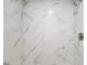 Close-up of a new shower featuring light marble-look tile and metal fixtures at 9378 N County Road 75 W, Lizton, IN 46149
