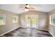 Well-lit sunroom with light walls, wood floor, and a ceiling fan at 9378 N County Road 75 W, Lizton, IN 46149
