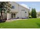 Grassy backyard with patio and sliding glass door provides a peaceful outdoor retreat at 9406 Avon Strand # Apt A, Avon, IN 46123