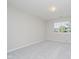 Neutral bedroom with gray carpet, white walls, and a window with a view at 9406 Avon Strand # Apt A, Avon, IN 46123