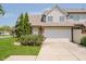 Charming townhome featuring an attached two-car garage and manicured lawn at 9406 Avon Strand # Apt A, Avon, IN 46123